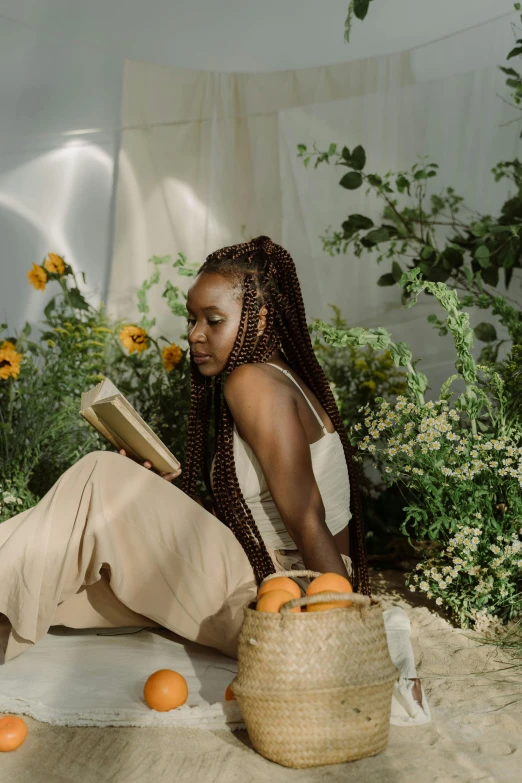 a woman sitting on the ground reading a book, by Lily Delissa Joseph, box braids, filled with plants, with backdrop of natural light, abcdefghijklmnopqrstuvwxyz