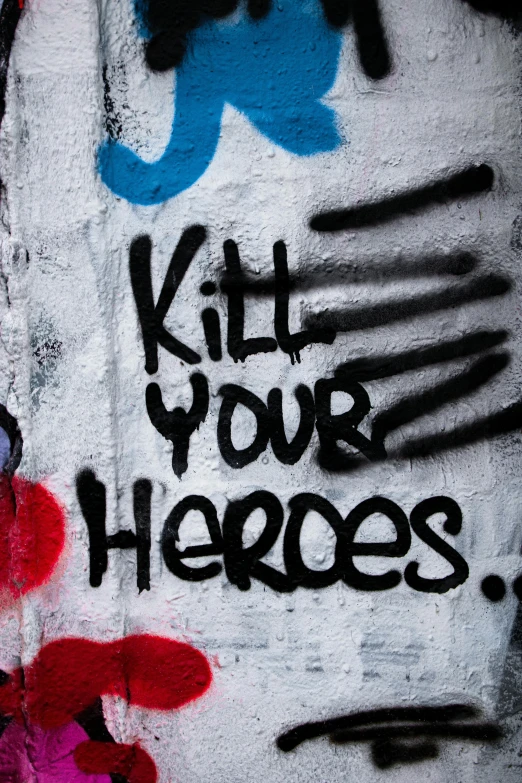 graffiti on a wall that says kill your heroes, flickr, graffiti, promo image, looking heroic, shot from below, thumbnail