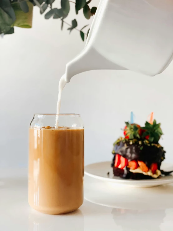 a cup of coffee being poured into a glass, by Tan Ting-pho, trending on unsplash, birthday cake, thumbnail, milk, background image