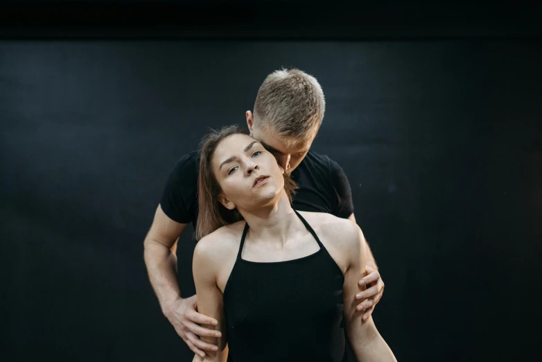 a woman in a black leo leo leo leo leo leo leo leo leo leo leo leo leo, by Emma Andijewska, unsplash, renaissance, man grabbing a womans waist, contemporary dance poses, neck up, sydney hanson