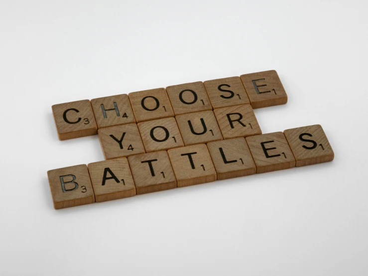 wooden scrabbles spelling choose your battles, an album cover, letterism, war and battle, battle toast, illustrious, 3 4 5 3 1