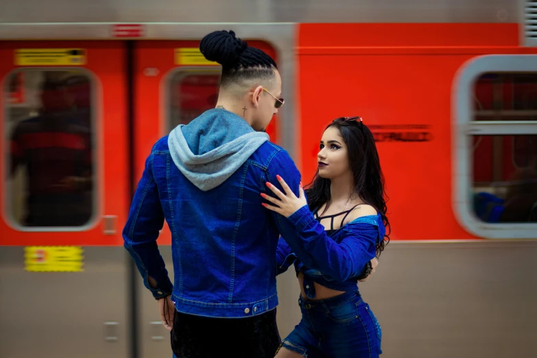 a man and a woman standing in front of a train, an album cover, pexels contest winner, bella poarch, blue clothes, russian girlfriend, lovely couple