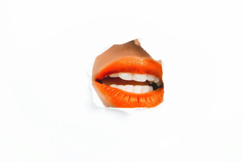 an orange lip sticking out of a hole in a piece of paper, trending on pexels, pop art, beautiful white teeth, orange body, glossy white, with a white
