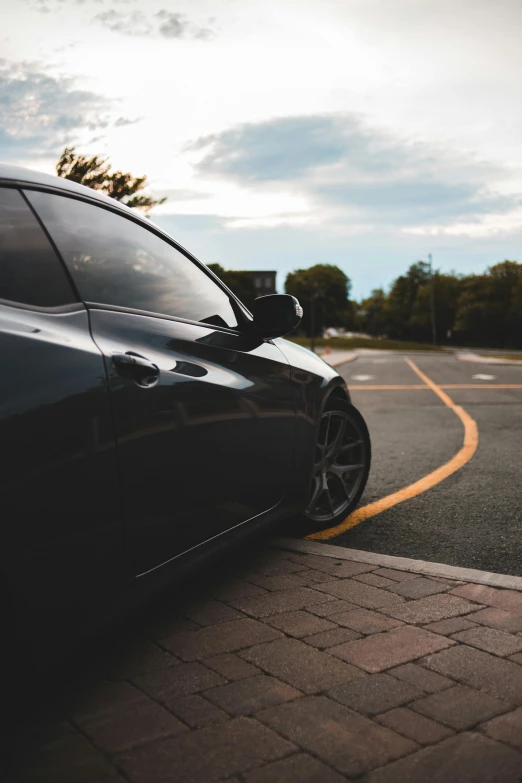 a black car parked on the side of the road, pexels contest winner, realism, profile picture, 2263539546], paved, 8k 50mm iso 10