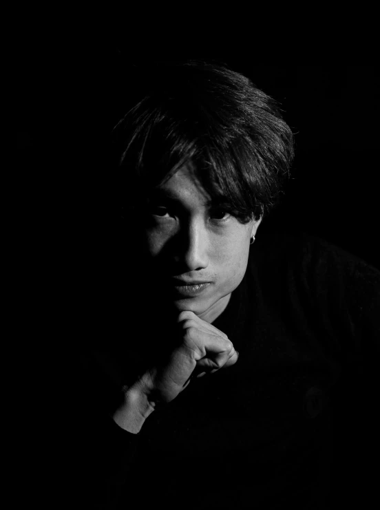 a black and white photo of a man with his hand on his chin, a black and white photo, inspired by Yamagata Hiro, unsplash, shin hanga, jungkook, promotional image, yagami light, chiaroscuro!!