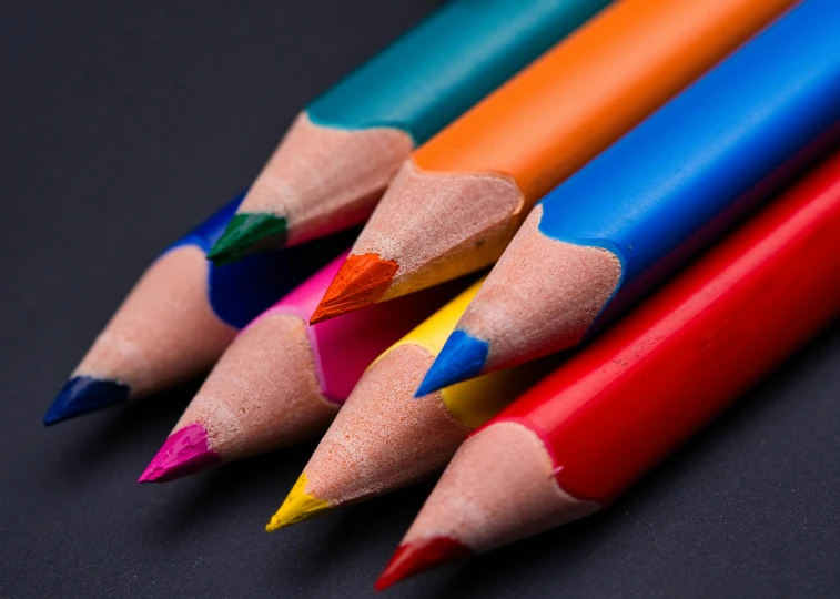 a group of colored pencils sitting next to each other, by Adam Marczyński, trending on pexels, crayon art, cobalt blue and pyrrol red, in front of a black background, thumbnail, colouring pages