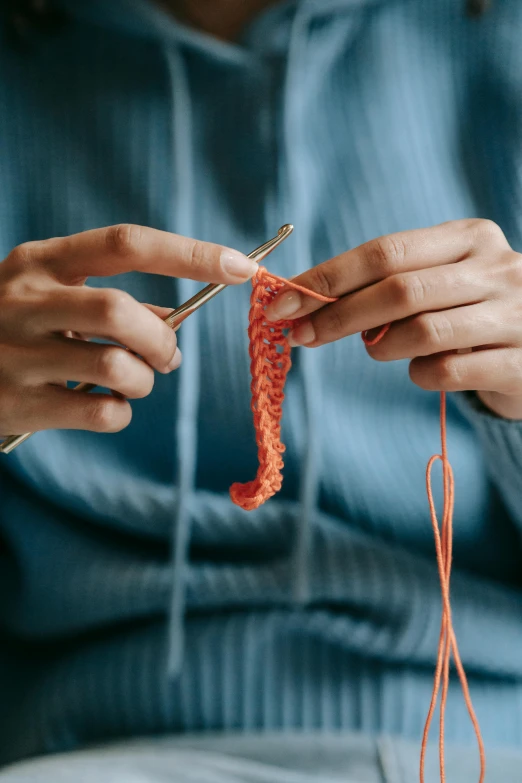a close up of a person knitting a piece of yarn, stringy, avatar image, no cropping, surgery