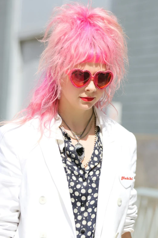 a woman with pink hair walking down a street, inspired by Yuko Tatsushima, trending on pexels, rococo, red hearts, imogen poots, half & half hair dye, with sunglass