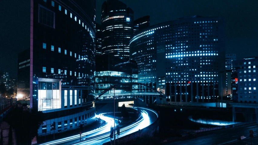 a city filled with lots of tall buildings at night, cyberpunk art, unsplash contest winner, city of the future in russia, optical fiber, street lighting, tron