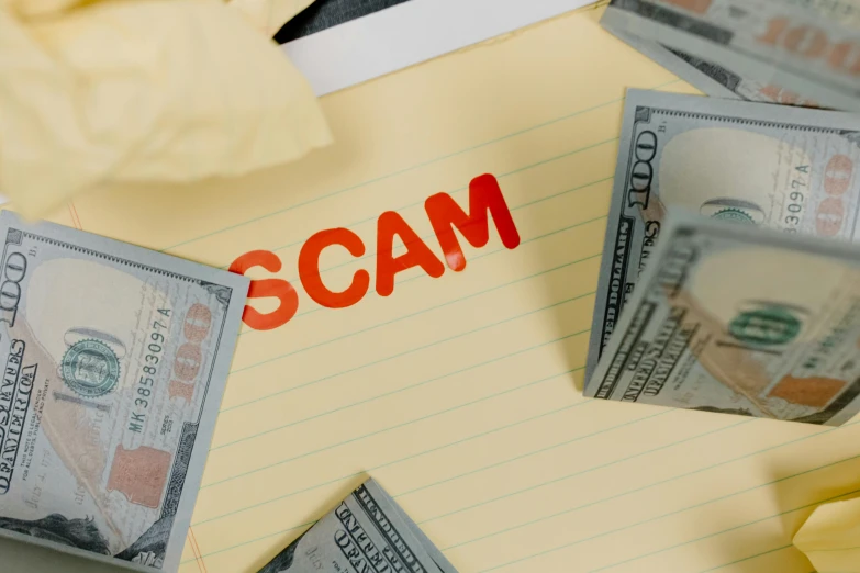 a pile of money sitting on top of a piece of paper, scamming, realistic »