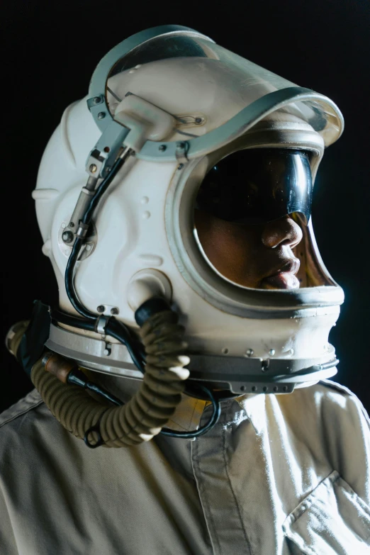a close up of a person wearing a space suit, profile posing, helmet, vintage pilot clothing, a still of an ethereal