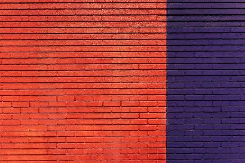 a fire hydrant in front of a brick wall, inspired by Christo, postminimalism, orange and purple color scheme, dark blue and red, background image, two - tone