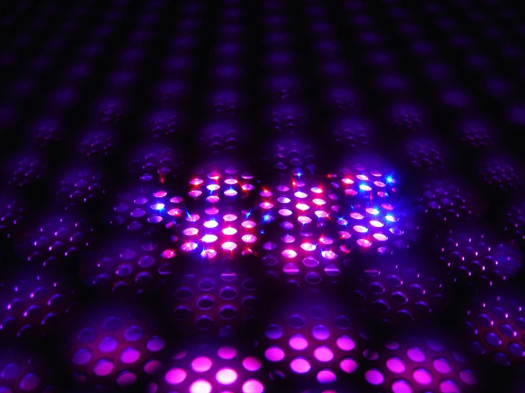 a close up of some lights in a dark room, a hologram, flickr, purple checkerboard, volumetric lighting - n 9, made of dots, modular graphene