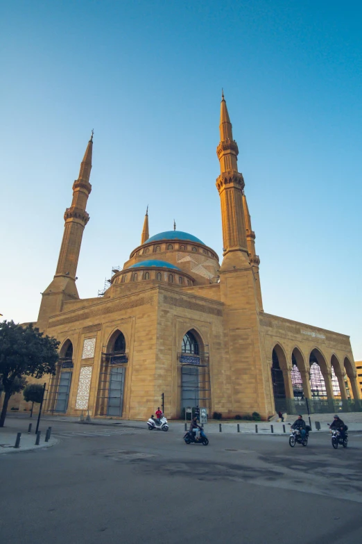 a group of people riding motorcycles in front of a large building, by Ahmed Yacoubi, pexels contest winner, hurufiyya, lebanon kirsten dunst, mosque, panorama view, 2 5 6 x 2 5 6