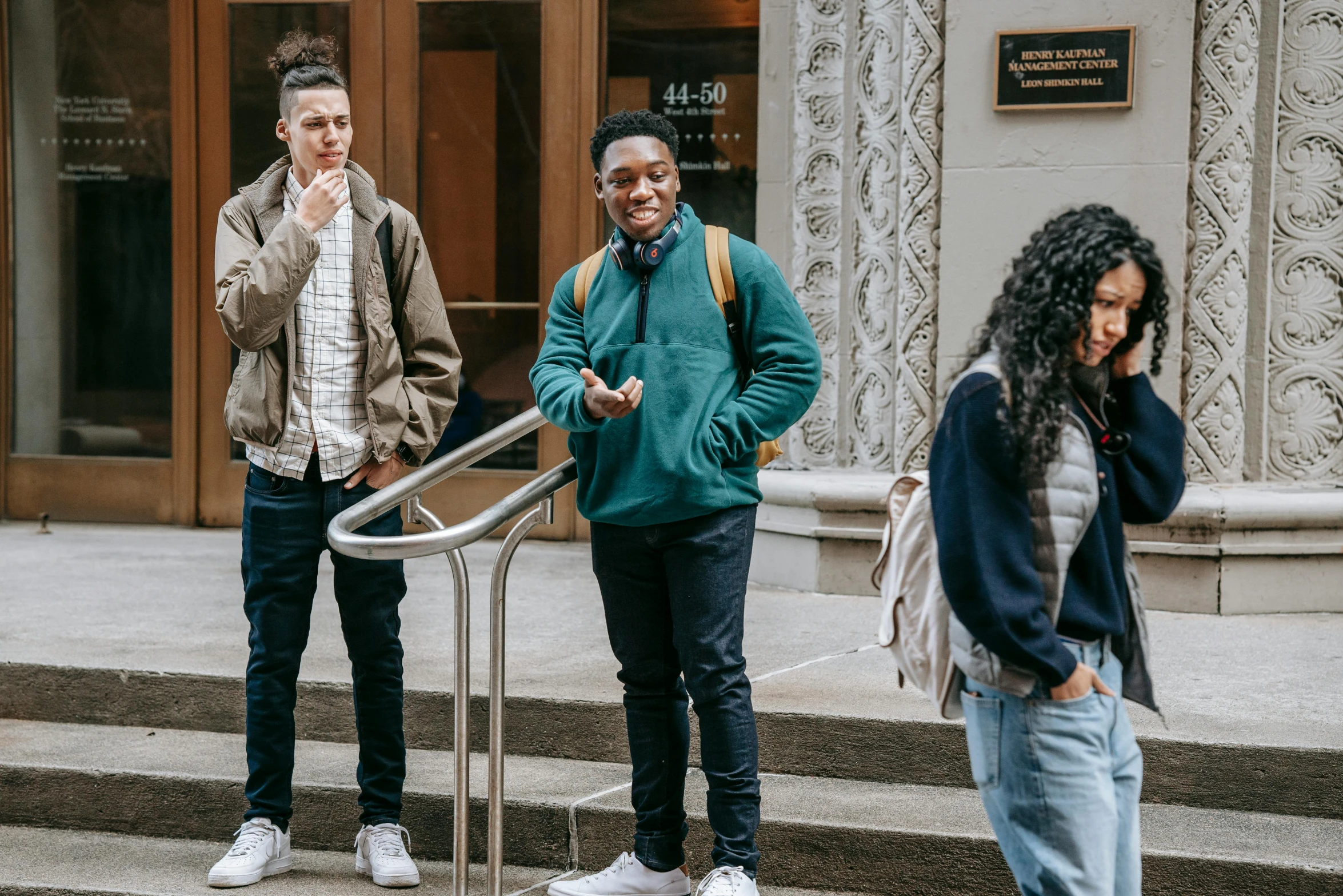 a group of people standing in front of a building, by Marshall Arisman, trending on pexels, renaissance, teenage boy, diverse, contemplating, green and brown clothes