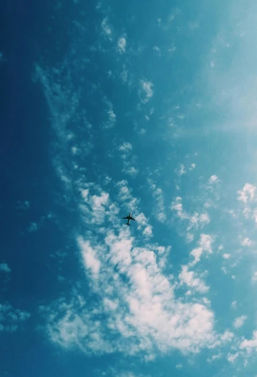there is a plane that is flying in the sky, by Niko Henrichon, minimalism, summer sky, profile image