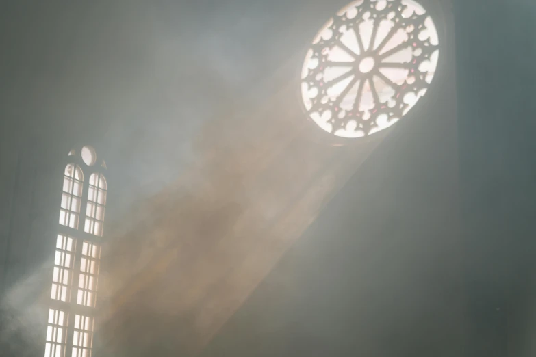 a couple of people that are standing in front of a window, unsplash contest winner, light and space, cathedral of sun, volume raytracing fog, sweaty. steam in air, in a church. medium shot