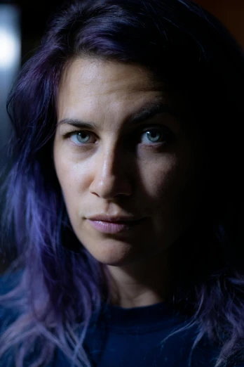 a close up of a person with purple hair, inspired by Elsa Bleda, antipodeans, looking serious, portrait of rugged adult female, promo image, multiple stories