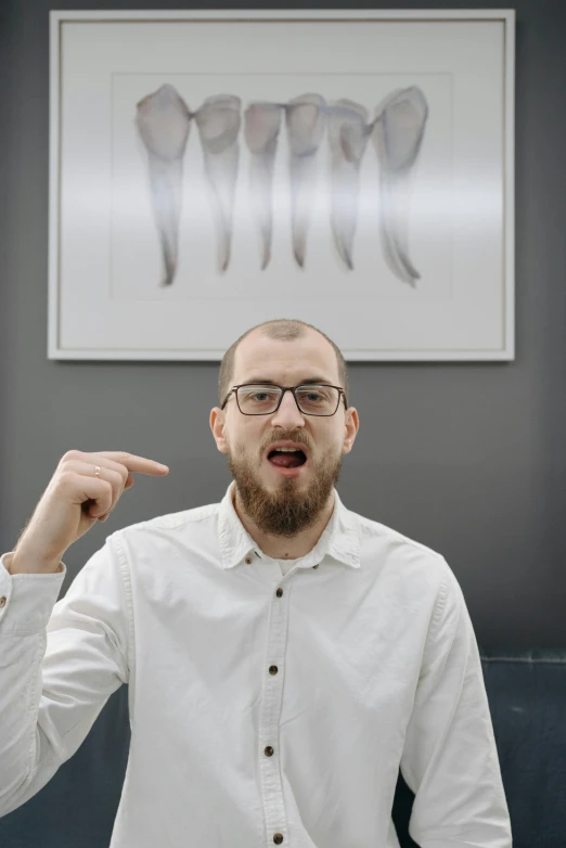 a man in a white shirt pointing at something, by Leo Leuppi, pexels contest winner, hyperrealism, buck teeth, in an office, justin roiland, фото девушка курит