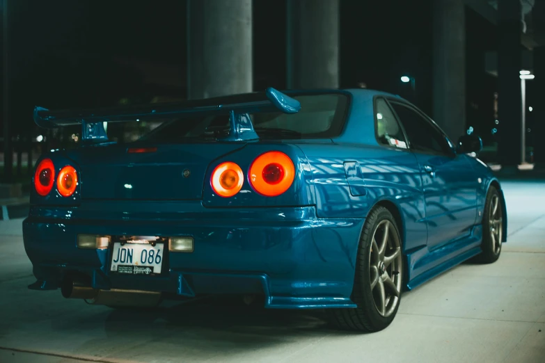 a blue car parked in a parking lot at night, inspired by An Gyeon, pexels contest winner, hyperrealism, in a modified nissan skyline r34, avatar image, cute photo, instagram post