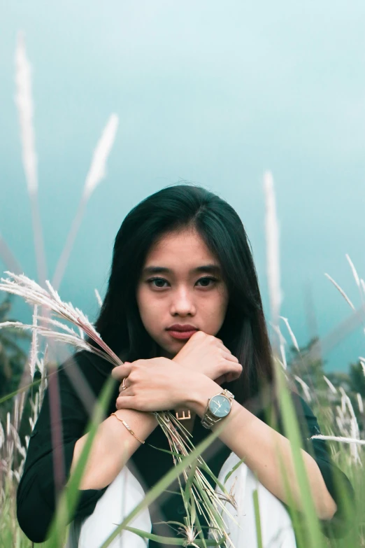 a woman standing in a field of tall grass, a picture, inspired by Ruth Jên, pexels contest winner, realism, young cute wan asian face, teenager, concert, ((portrait))