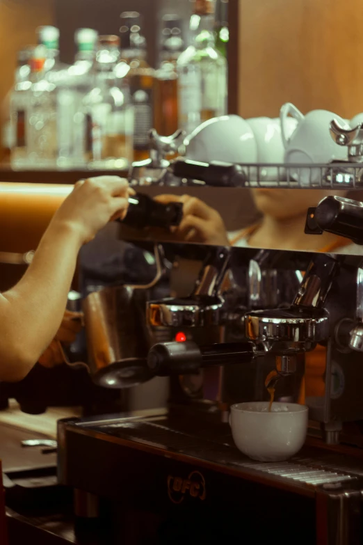 a woman is making a cup of coffee, inspired by Elsa Bleda, **cinematic, highly mechanical, aussie baristas, shaven