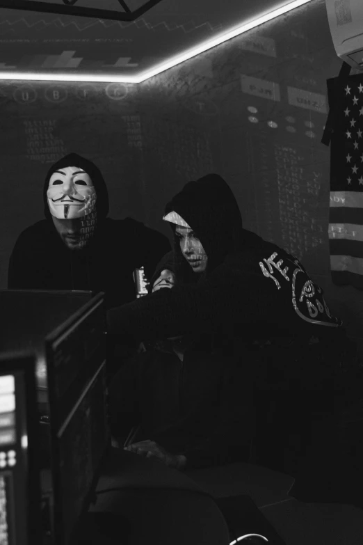 a group of people sitting in front of a computer, a black and white photo, by Bascove, tumblr, sots art, ski mask, gang flags, 15081959 21121991 01012000 4k, medium shot of two characters