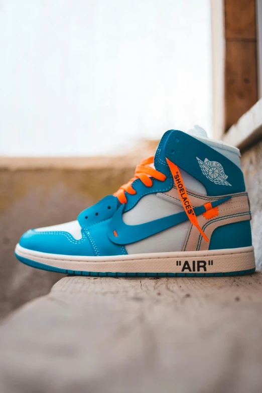 a pair of sneakers sitting on the ground, unsplash, hyperrealism, blue!! with orange details, wearing off - white style, jordan, avatar image