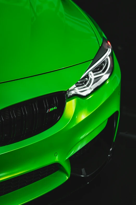 a green car parked in a parking lot, inspired by An Gyeon, pexels contest winner, synchromism, bmw, dynamic closeup, avatar image, fluo details
