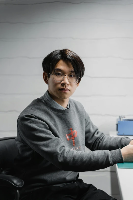 a man sitting at a desk in front of a computer, featured on reddit, shin hanga, halfbody headshot, studio photo, stood in a lab, xqcow
