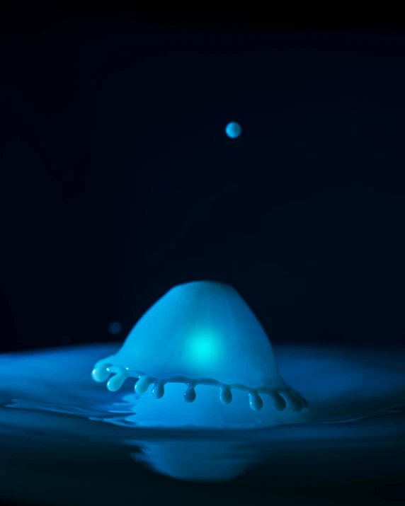 a drop of water falling into a pool of water, a hologram, by Ryan Pancoast, blue bioluminescent plastics, robotic octopus, foamy bubbles, dingy lighting