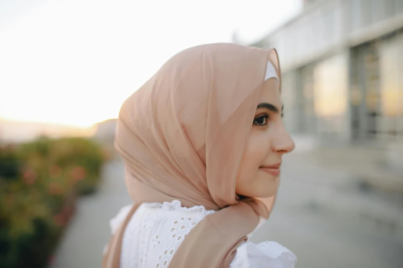 a close up of a person wearing a hijab, trending on pexels, hurufiyya, light tan, beautiful day, slightly smiling, chiffon