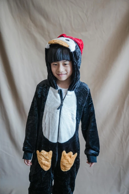 a little girl dressed in a penguin costume, inspired by Xie Huan, black, f/2, thumbnail, boys