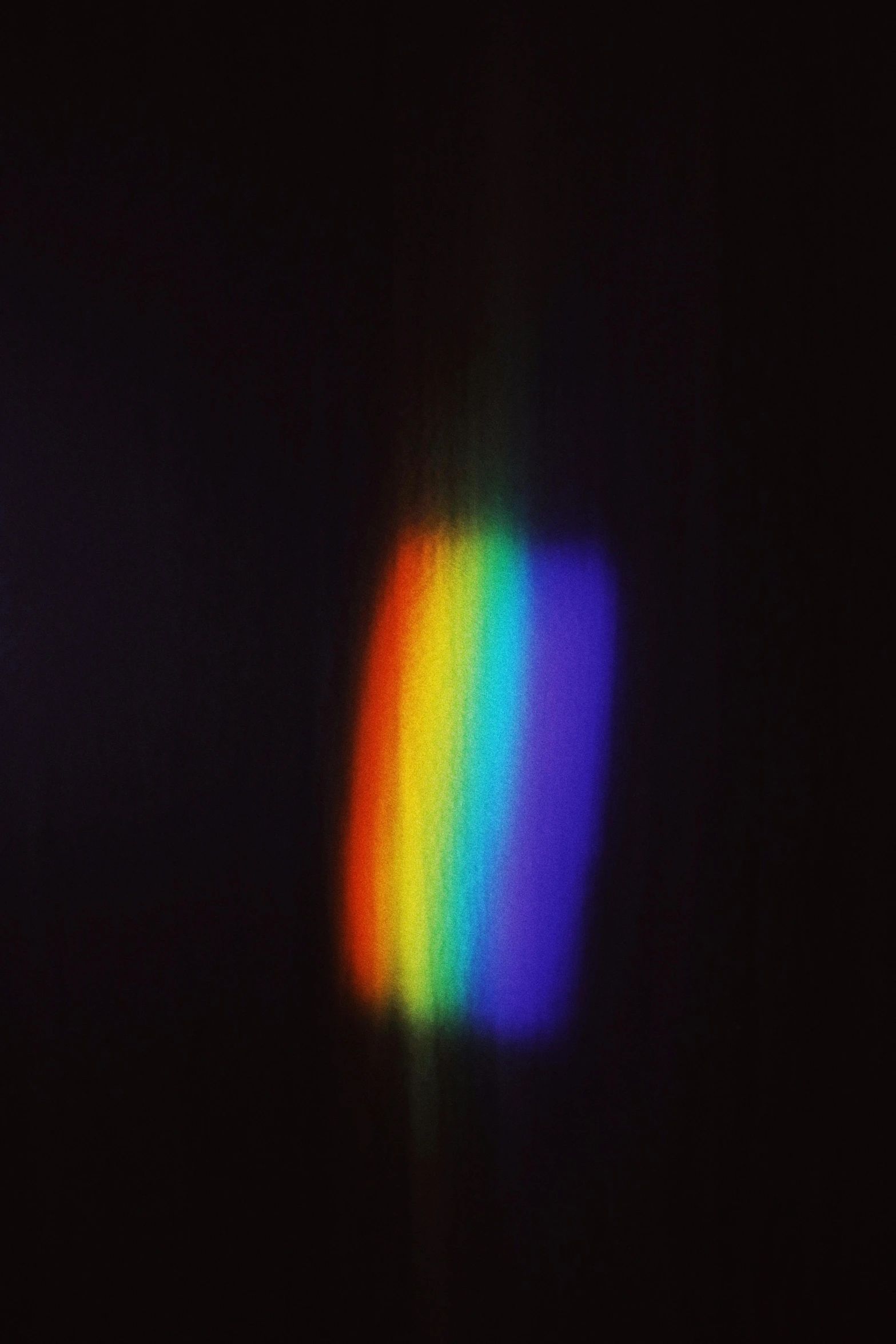 a rainbow colored light shines brightly on a black background, unsplash, holography, grainy low quality photograph, shot on a 2 0 0 3 camera, → ⃣ spectrum darkness prime, album cover