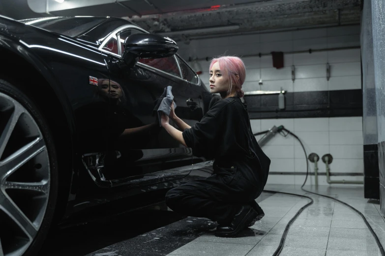 a woman working on a car in a garage, by An Gyeon, pexels contest winner, hyperrealism, hair detailing, square, doja cat, wearing black clothes