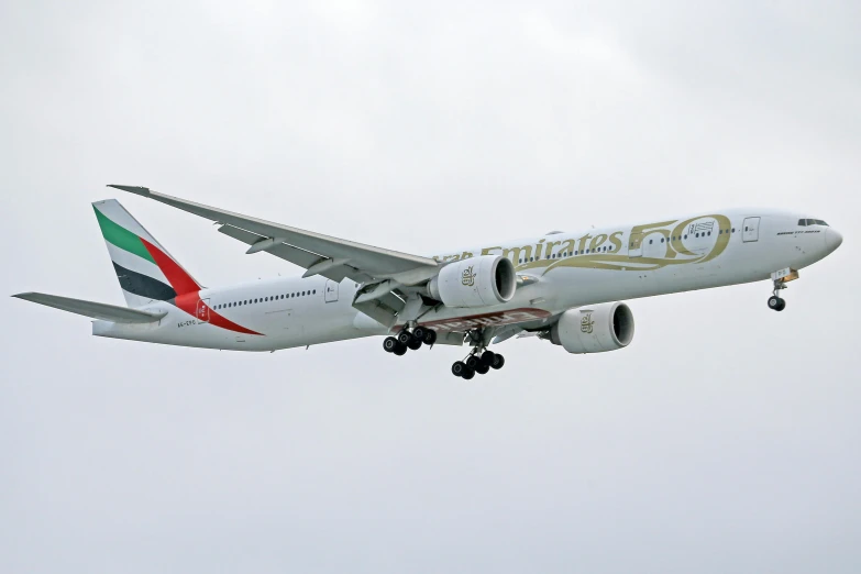 a large passenger jet flying through a cloudy sky, a picture, arabesque, taken in 2022, dubai, full - body - front - shot, slide show