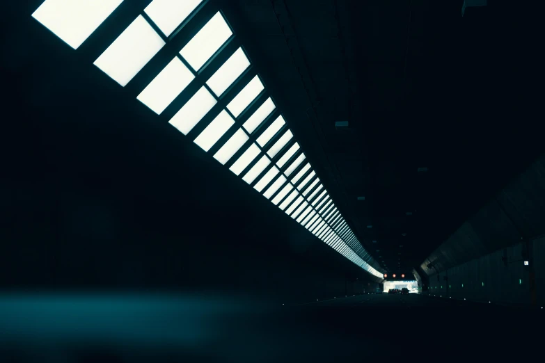a train traveling through a train station at night, inspired by Elsa Bleda, light and space, spaceship hallway, brutalist liminal architecture, instagram picture, cinematic shot ar 9:16 -n 6 -g