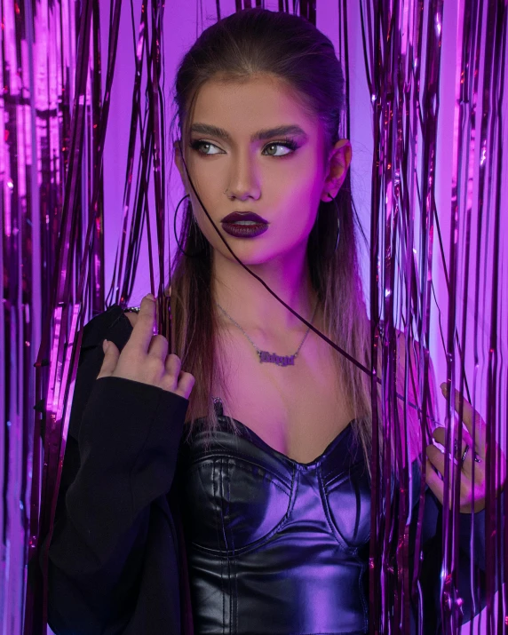 a woman standing in front of a purple background, inspired by Elsa Bleda, trending on pexels, graffiti, black leather choker, model エリサヘス s from acquamodels, fashionable dark witch, zendaya