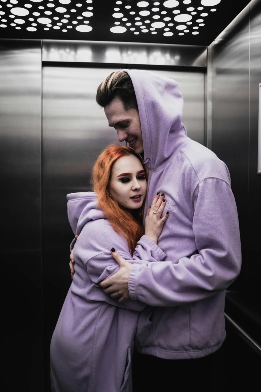 a man and a woman hugging in an elevator, a colorized photo, trending on pexels, lilac hair, ( redhead, uwu, anton fadeev 8 k