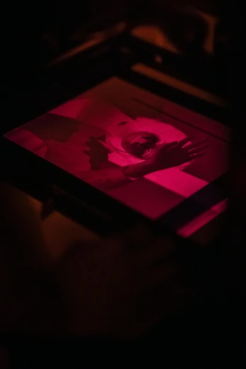 a person holding a pink light in their hand, a silk screen, unsplash, video art, red laser, cinematic frame, engraved, chiaroscuro