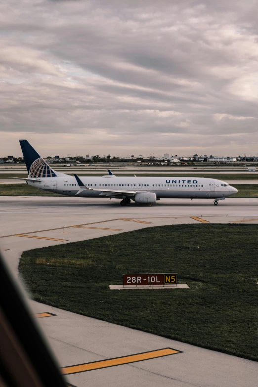 a large jetliner sitting on top of an airport tarmac, by Carey Morris, unsplash contest winner, chicago, avatar image, upright, gif