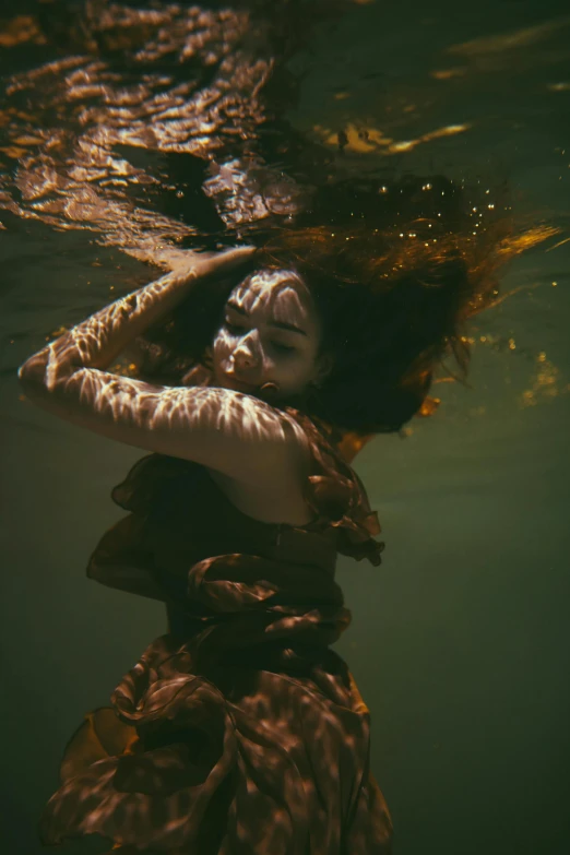 a woman in a long dress swims under water, inspired by Brooke Shaden, unsplash contest winner, 4 k photo autochrome, ilustration, brown water, ignant