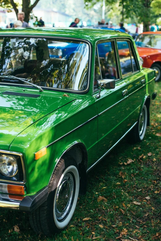 a green car parked on top of a lush green field, pexels contest winner, photorealism, russian lada car, various colors, square, profile picture