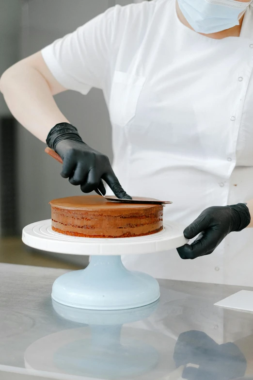 a woman in a white shirt and black gloves cutting a cake, black matte finish, thumbnail, silicone cover, brown