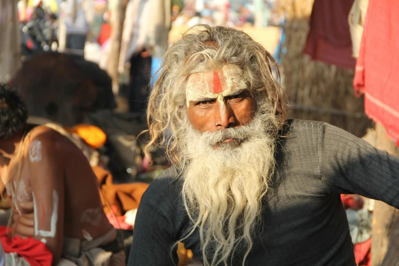 a man with a long beard and white paint on his face, pexels contest winner, samikshavad, center of picture, loincloth, avatar image, an oldman