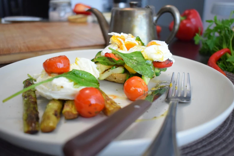 a close up of a plate of food on a table, by Anna Findlay, pexels contest winner, eggs, mozzarella, diner caffee, at full stride