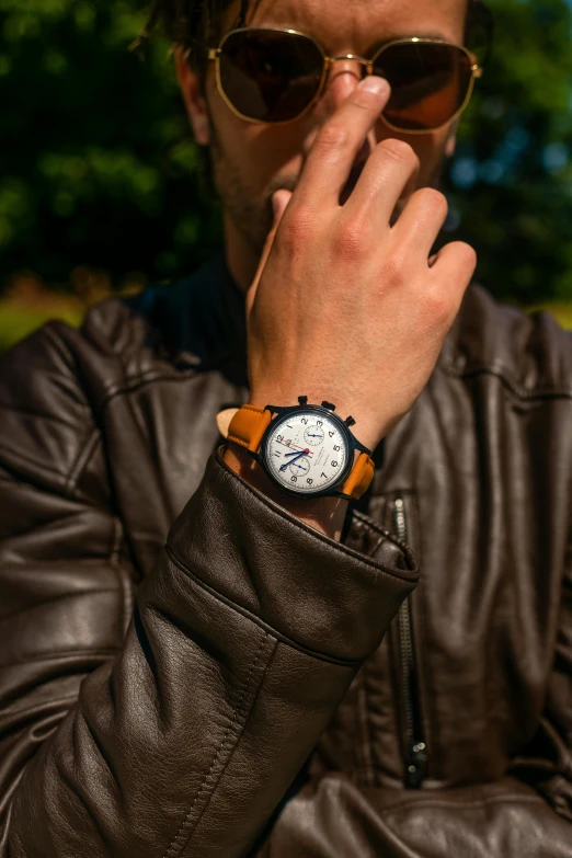 a man in a leather jacket smoking a cigarette, unsplash, photorealism, wears a watch, avatar image, tan, product shot