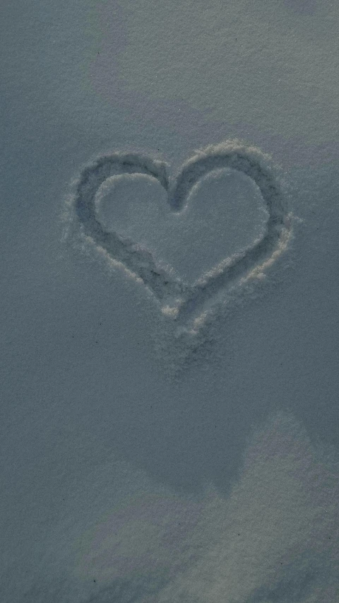 a heart drawn in the snow on a sunny day, an album cover, inspired by Vija Celmins, pexels, powder, islamic, 15081959 21121991 01012000 4k