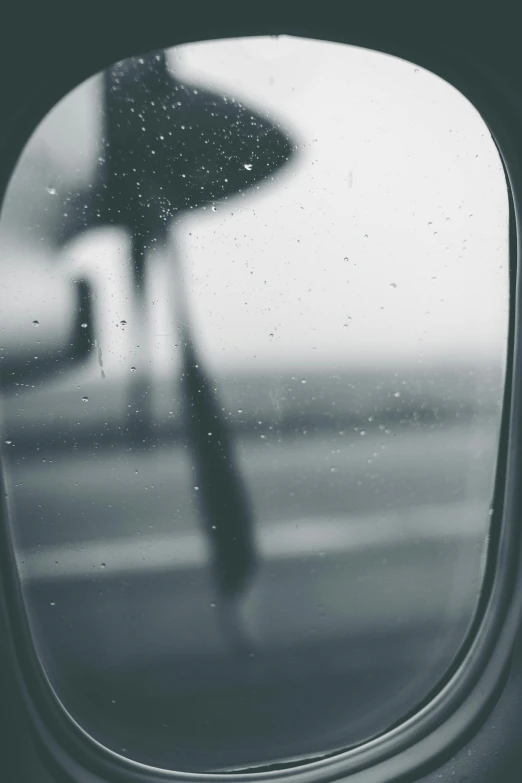 a black and white photo of an airplane window, pexels contest winner, magical realism, like tears in rain time to die, album cover, 'wherever you go, concert