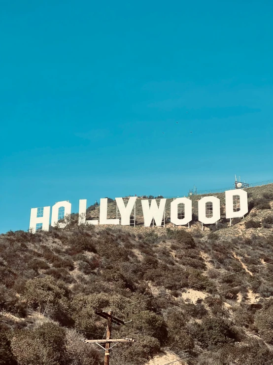 a large hollywood sign on top of a hill, slide show, ☁🌪🌙👩🏾, instagram story, high quality photo